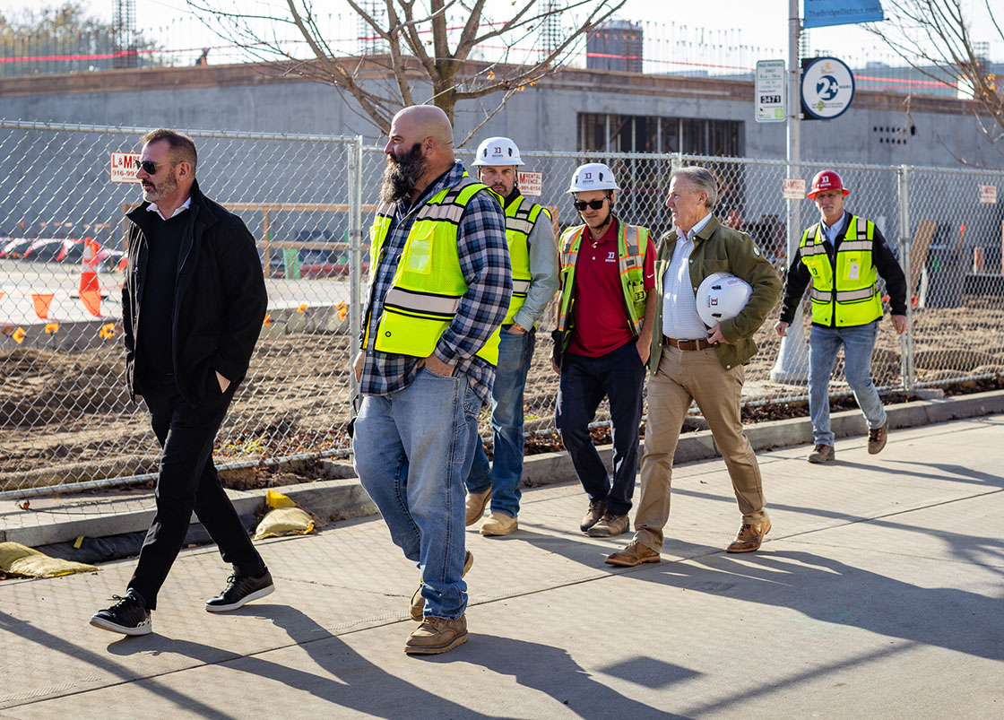 Brown Construction Pierside project management team walking with Ron Brown