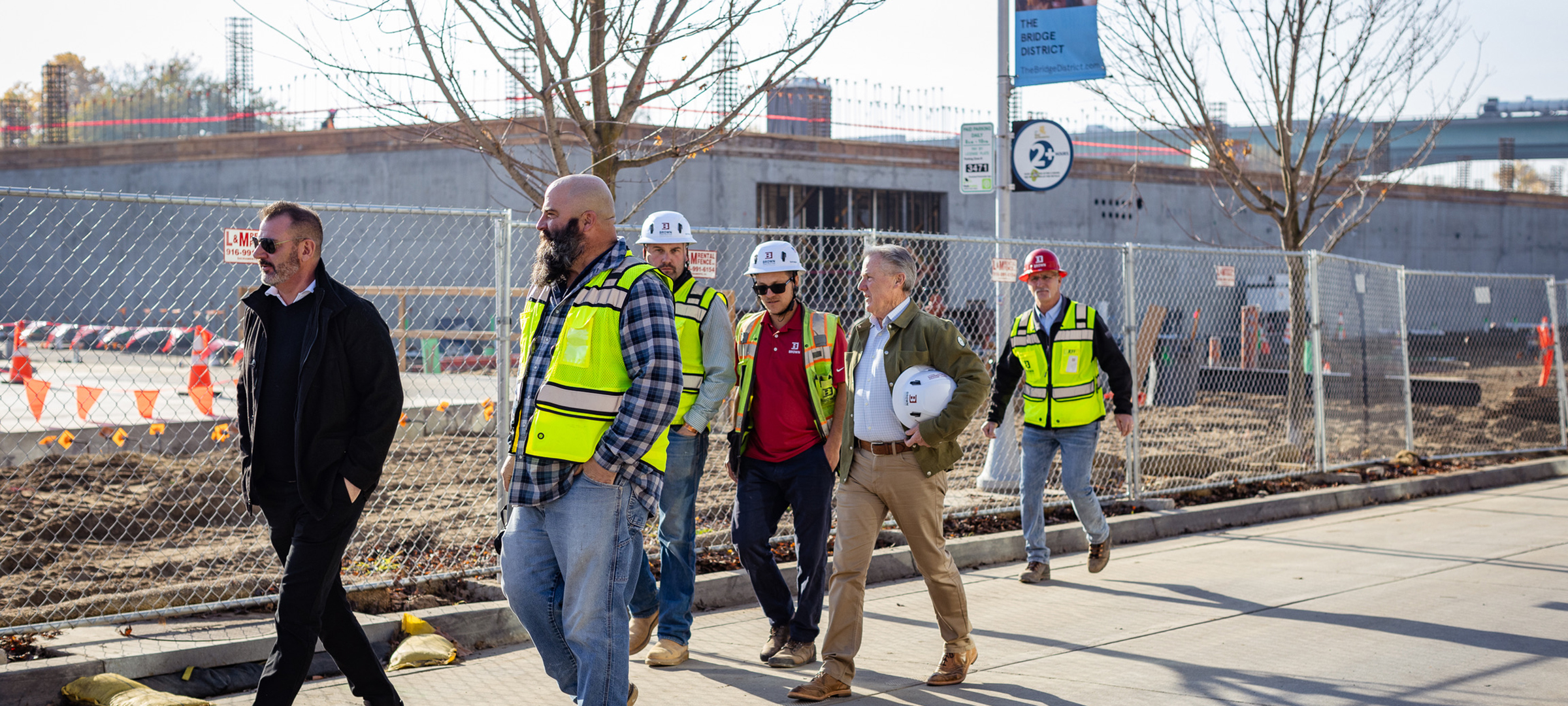 Brown Construction Pierside project management team walking with Ron Brown