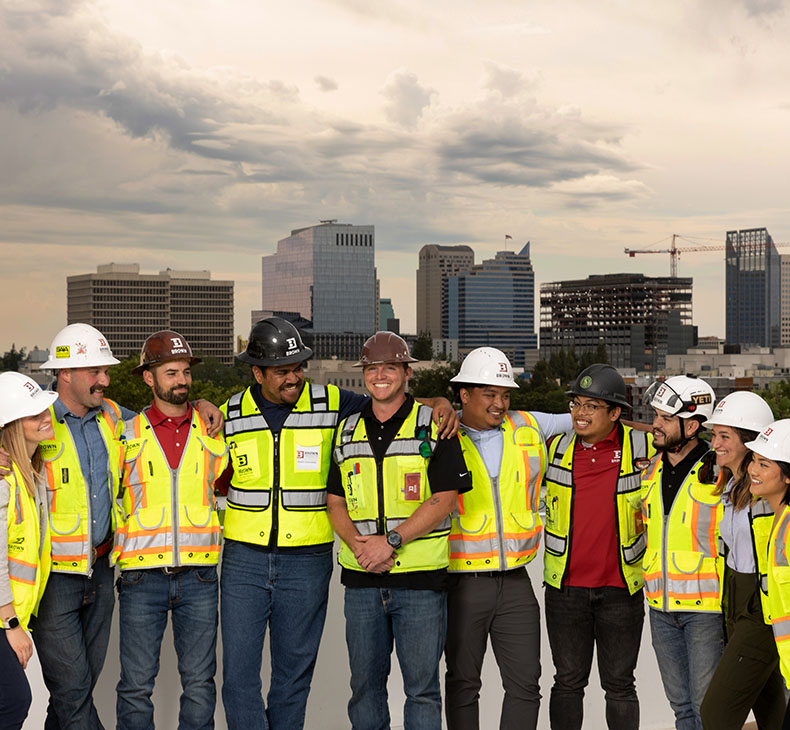 Brown Construction young professionals on the roof at Maker