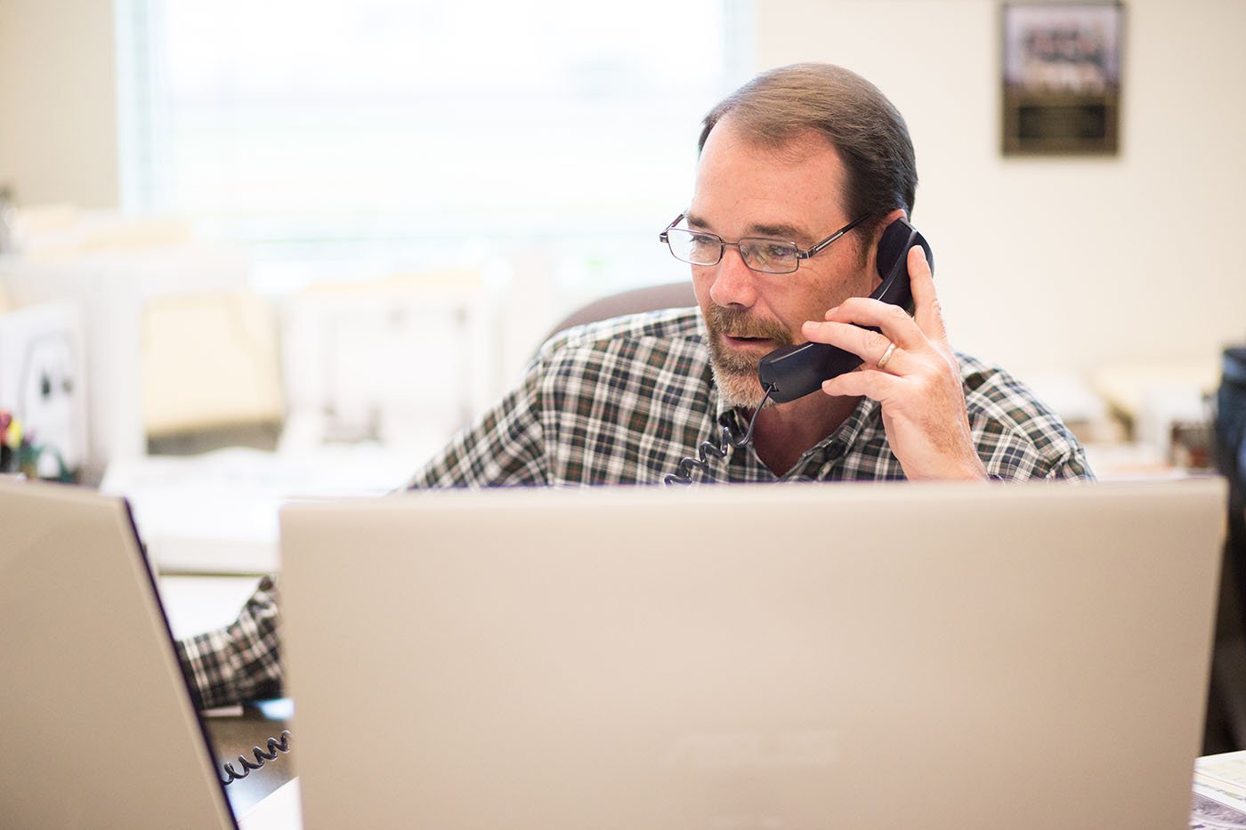 Collin Nichols working in his office