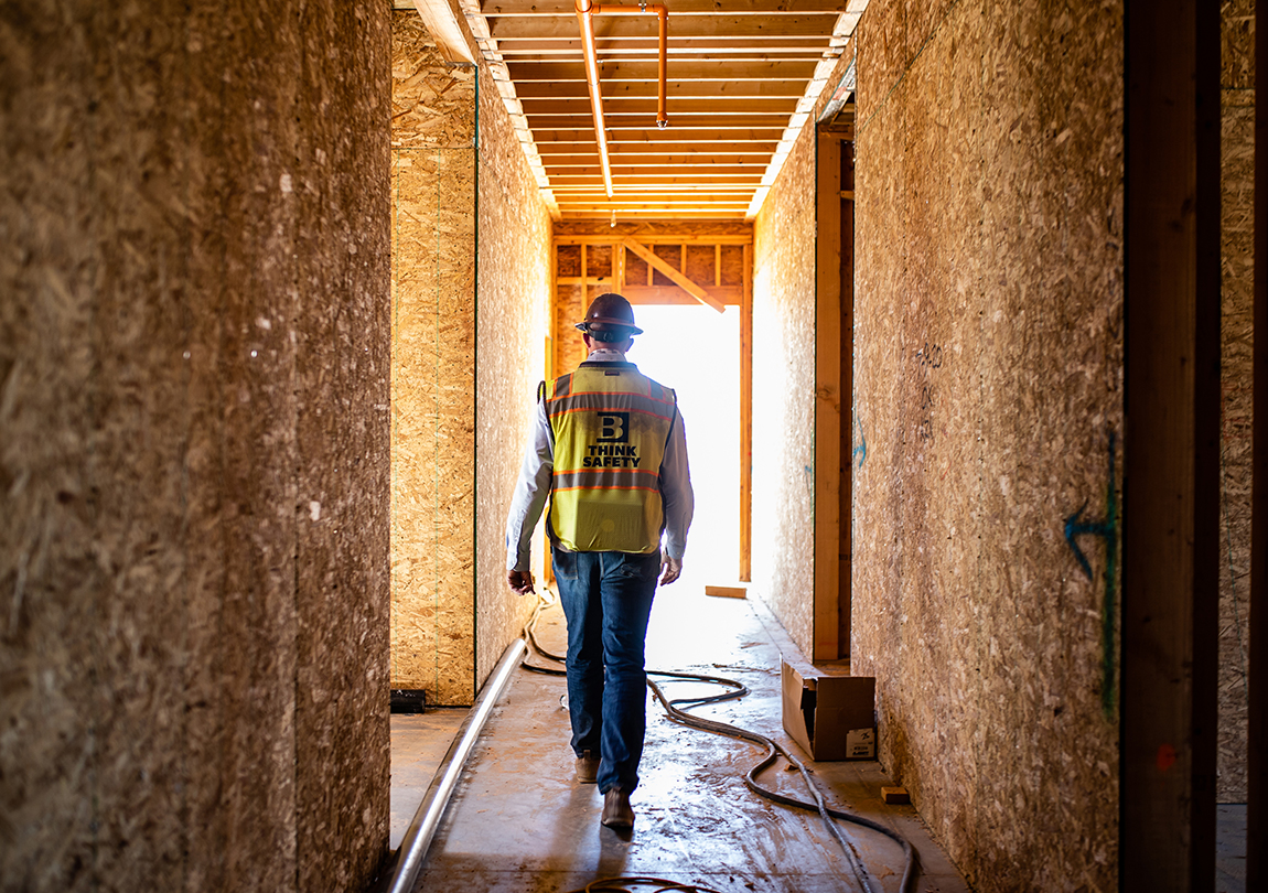 Kent Keller walking Holden IL job site in Roseville